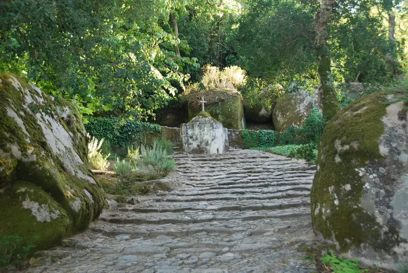 The moss-covered stone cloister of the Convent of the Capuchos in Sintra