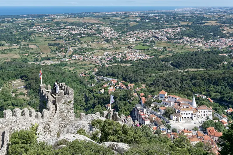 The stone ramparts of the Moorish Castle climbing the ridge of the Sintra hills